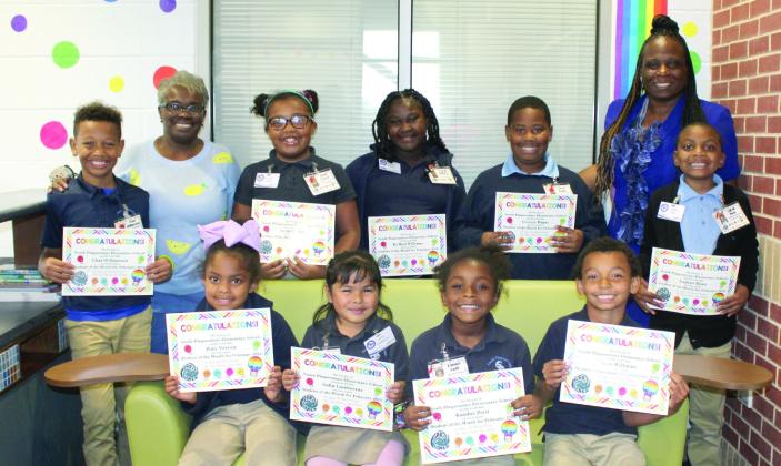 SPES FEBRUARY STUDENTS OF THE MONTH - Pictured in the back row, from left: Chaz Williamson, Mrs. Tonya Redmond (SPES Assistant Principal), Sa’Mi Parker, Ky’Reil Williams, Connor Ragas, Dr. Stacey-Ann Barrett (SPES Principal) and Lajhaii Bean. Front row: Zoey Vereen, Sofia Lumbreras, Kambri Petit and Obre Williams. Not pictured: Keyiara Davis.